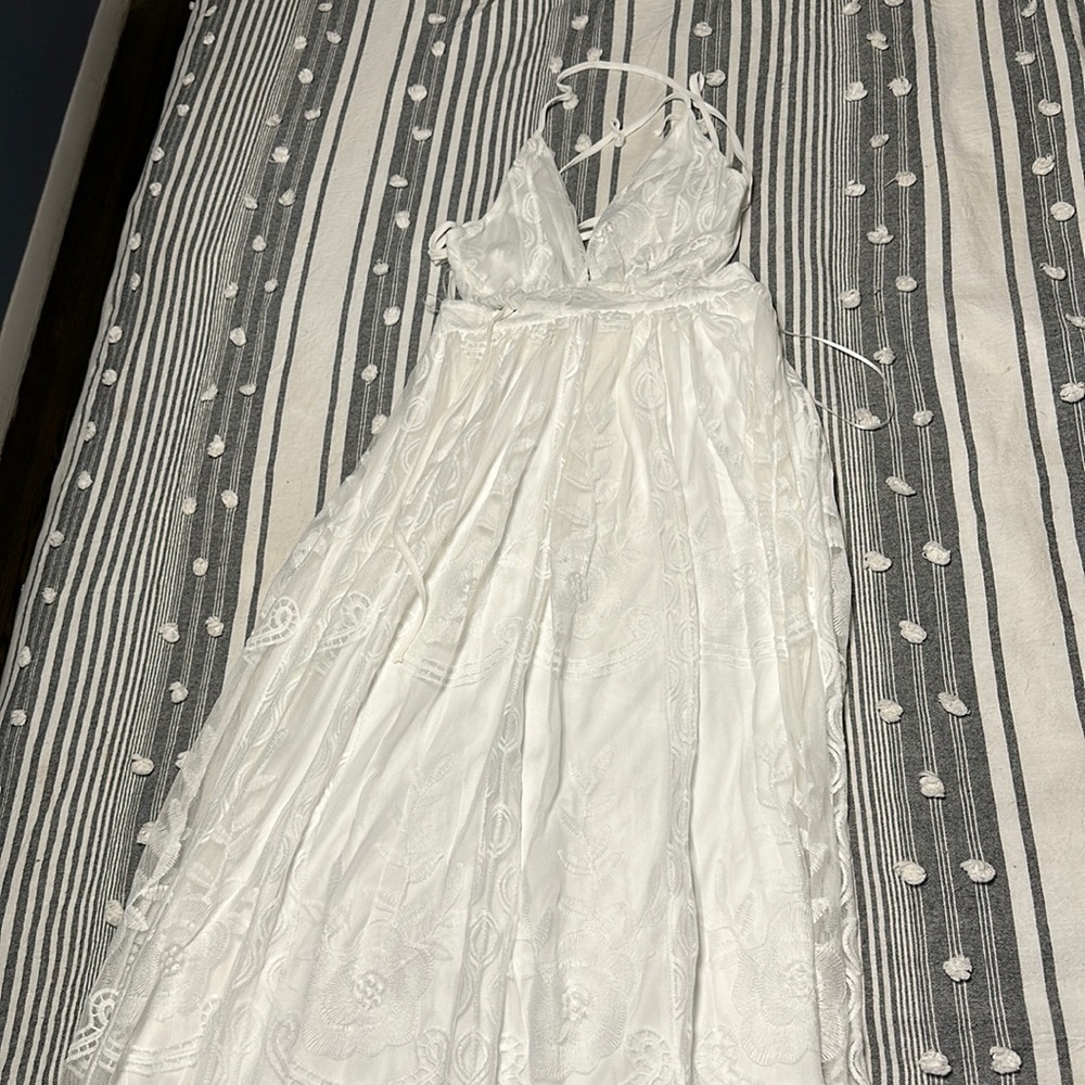 Small white long lace dress never worn before.